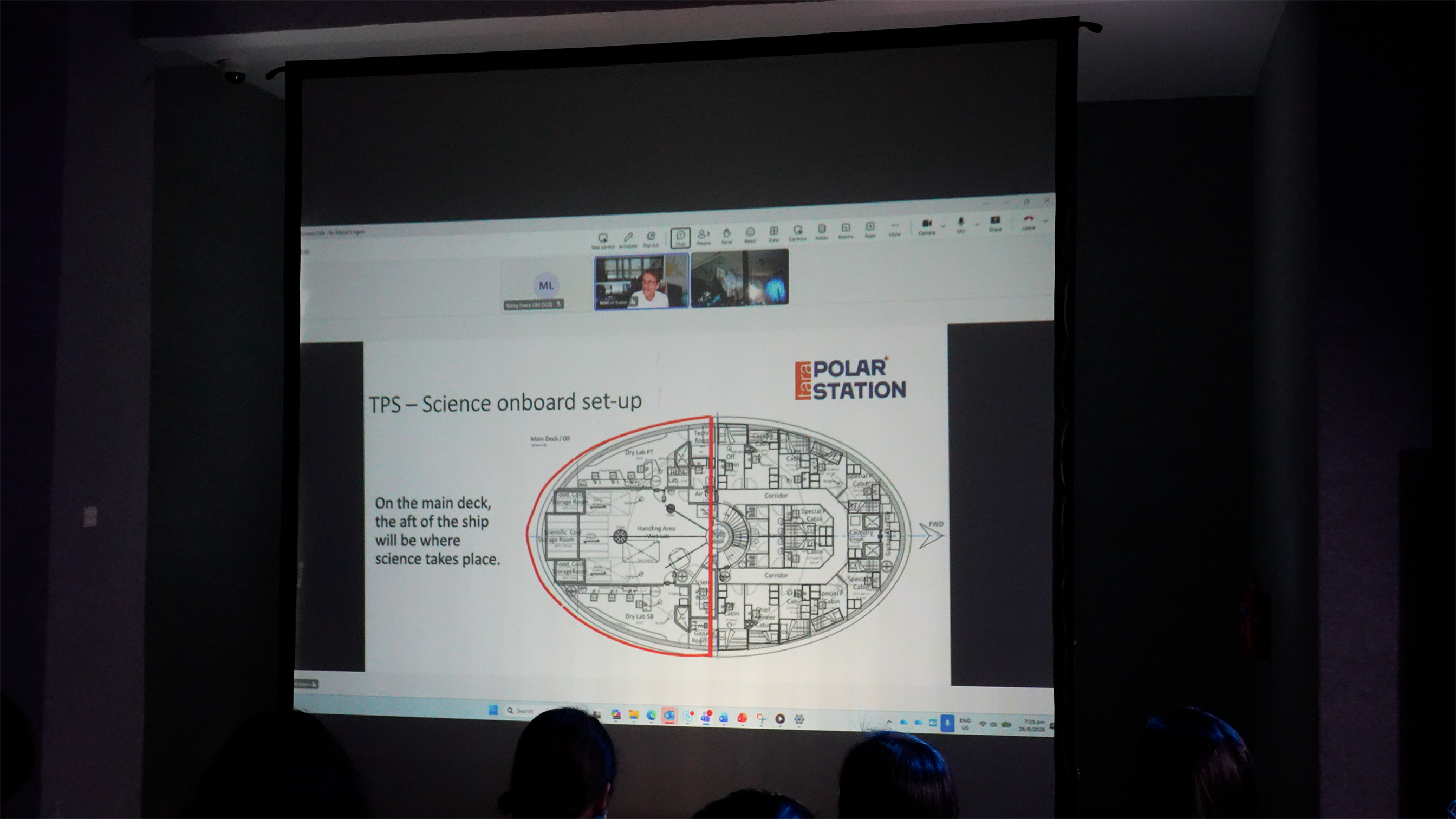 Photo of Marcel explaining the Tara Polar Station science onboard set-up